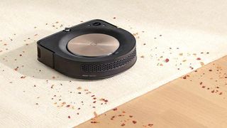 Roomba S9+ cleans crumbs off floor